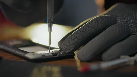 Scheme. A workshop worker equipped with tools holds a screwdriver in his han Stock Footage 278246134