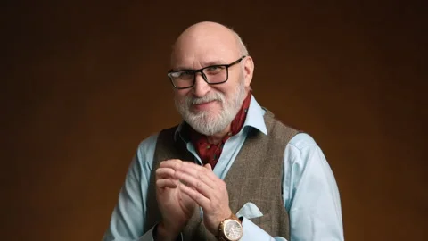 Scheming Man with Cunning Smile, Clasping Hands in a Crafty Plan Stock Footage 264089361