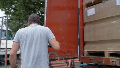 Schimmert, The Netherlands - August 3, 2017 - Man Opens The Back Of A Truck Stock Footage 129398724