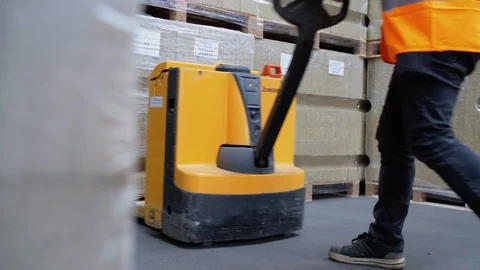 Schimmert, The Netherlands - August 3, 2017 - Construction Worker Taking Pallet Video stock 129398822