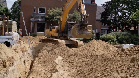 Schimmert, The Netherlands - August 3, 2017 - Excavator Digging Sand At Village Video stock 129398849