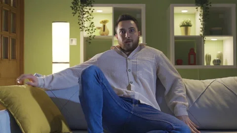 The schizophrenic sitting alone at home is afraid of hallucinations 스톡 동영상 231011883