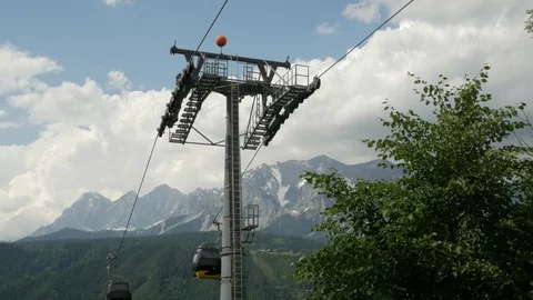 Schladming to Planai Summit cable car, Upper Austria Mountains in the distance Stock Footage 113830243