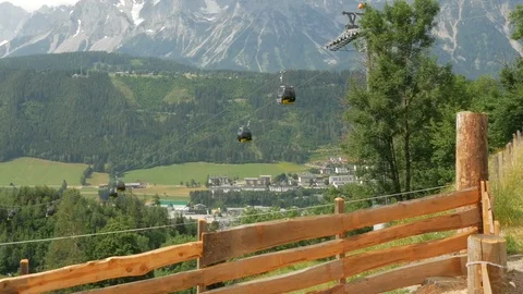 Schladming to Planai Summit cable car, Upper Austria Mountains in the distance Stock Footage 113830591