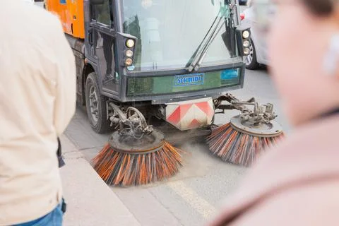 Schmidt cleaning machine sweeps road asphalt in city street, sweeper car Stock-Fotos