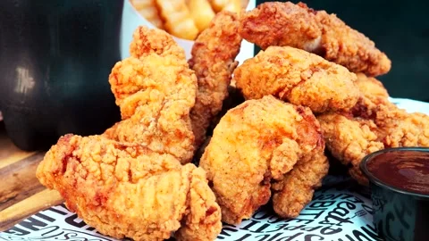 Schnitzel and fried potatoes on dark plate, Stock Footage 293806167