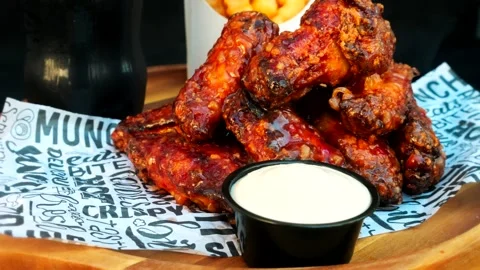 Schnitzel and fried potatoes on dark plate, Stock Footage 293806216