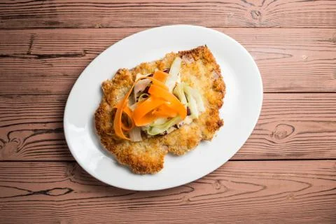 Schnitzel  breaded on desk Stock Photos