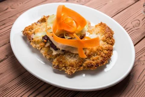 Schnitzel  breaded on desk Stock Photos