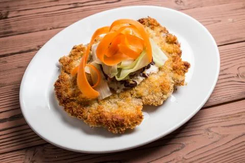 Schnitzel  breaded on desk Stock Photos