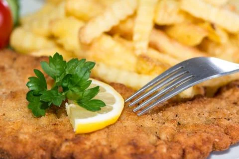 Schnitzel with chips Stock Photos