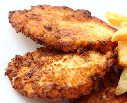 Schnitzel with fries Stock Photos