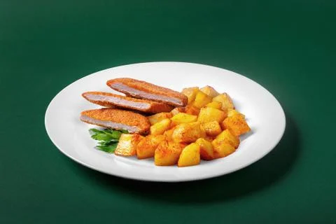 Schnitzel with potatoes for the menu Stock Photos