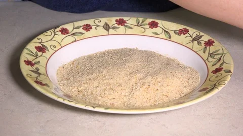 Schnitzel rolled in breadcrumbs Stock Footage 106648213