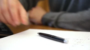 Scholar Writing note on paper Stock Footage 85881638