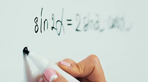 Scholar wrote on a white board formula Stock Footage 68629160