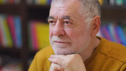 Scholarly Vision Front View of Elderly Man Amid Bookshelves Stock Footage 274287911