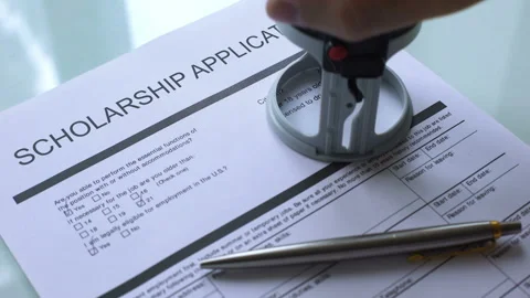 Scholarship application document approved, hand stamping seal on official paper Stock Footage