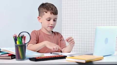 The schollboy calculates with the help of mental arithmetic  Stock Footage 280141851