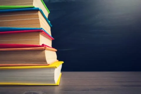 School accessories on the table with blackboard background Stock Photos