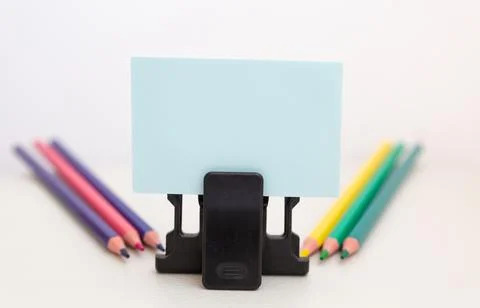 School accessories on a White table, sheet of paper and pencils Foto stock