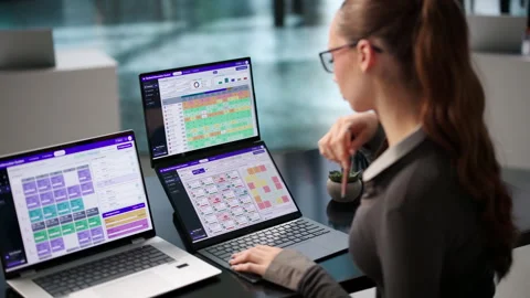 School Administrator Carefully Updates Student Attendance Records Stock Footage 343887907