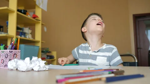 A school-age boy does homework at home. Training at school Stock Footage 147122703