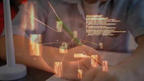 School-age boy placing green pencil onto blank notebook generating glowing Stock Footage 312347762