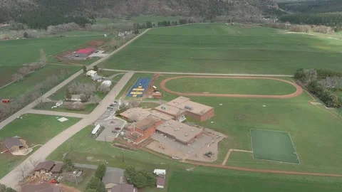 School and surrounding fields in Beulah Colorado, aerial view Stock Footage 153607076
