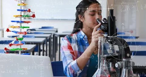 In school, Asian girl using microscope in science classroom, focused on Illustrazione stock