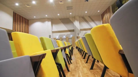 School auditorium with row of chairs for students listening Stock Footage 247088310
