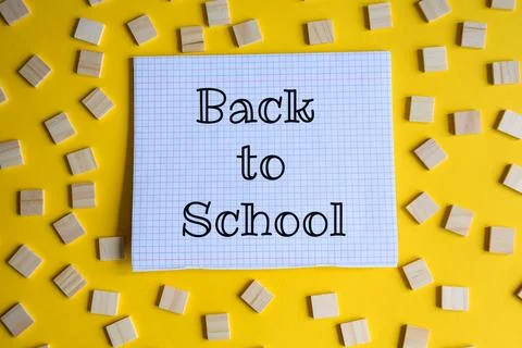 School Backpack with Colored Pencils Notebooks and Pens on Yellow Background Stock Photos