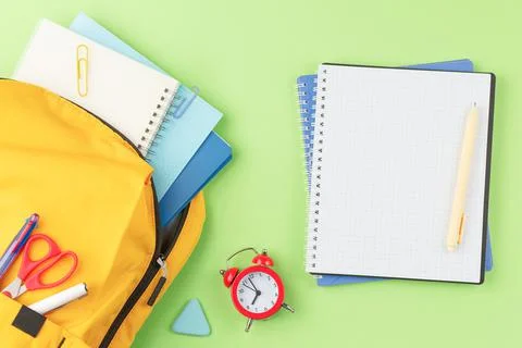 School backpack with educational supplies. Stock Photos