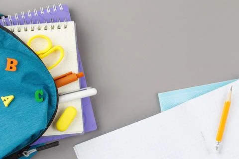 School backpack with educational supplies. Stock Photos
