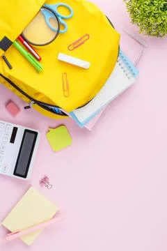 School backpack with educational supplies. Stock Photos