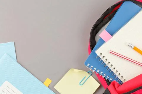 School backpack with educational supplies. Stock Photos
