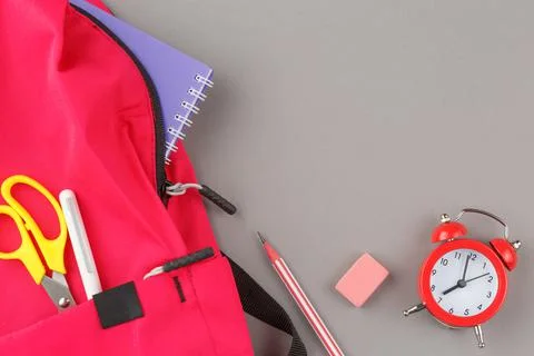 School backpack with educational supplies. Stock Photos