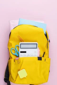 School backpack with educational supplies. Foto stock