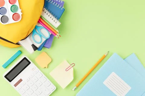 School backpack with educational supplies. Stock Photos