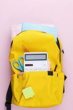 School backpack with educational supplies. Stock Photos