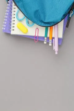 School backpack with educational supplies. Stock Photos