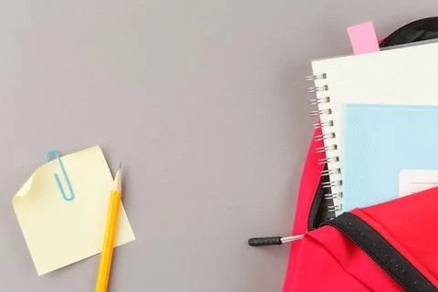 School backpack with educational supplies. Stock Photos