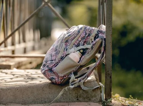 School backpack at the street Stock Photos