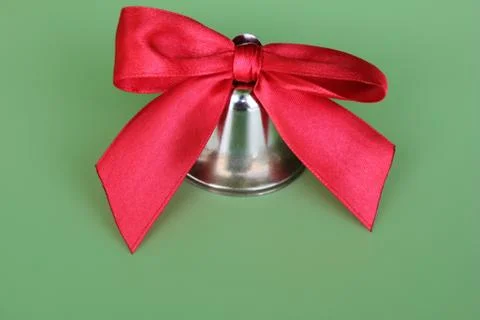 School bell with a red bow close-up. Stock Photos
