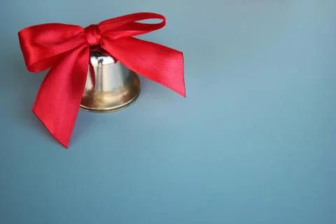 School bell with a red bow close-up. Copy Space. Stock Photos