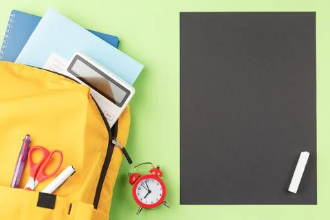 School board with backpack and study supplies. 库存照片