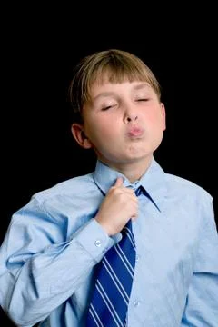 School boy adjusting tie Stock Photos