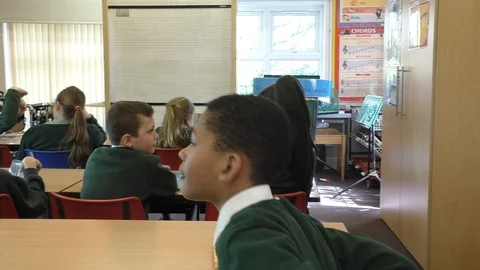 School boy chatting in class 스톡 동영상 94011789