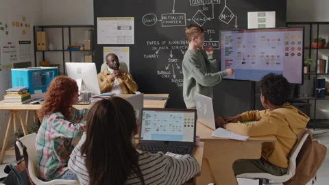 School Boy Explaining Computer Algorithm on Digital Screen on Lesson Stock Footage 245458928
