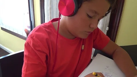 School boy with headphone using laptop 2 Stock Footage 81105428